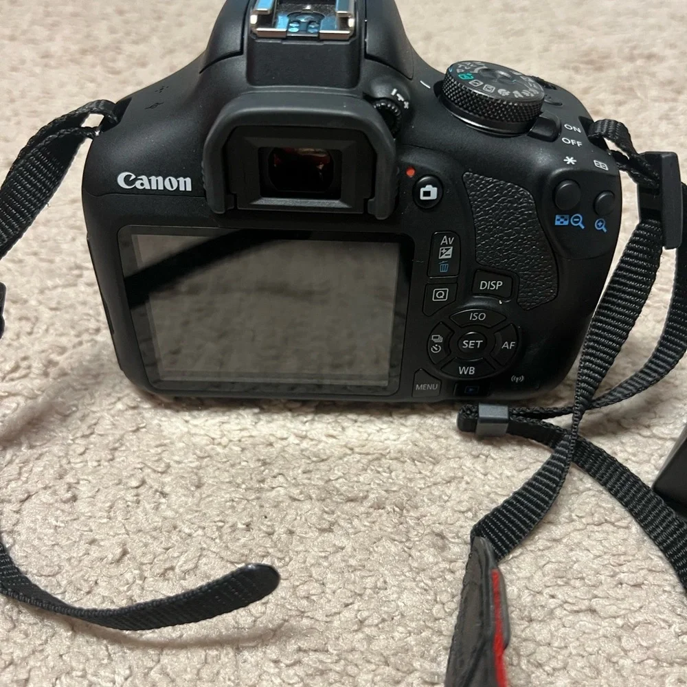 Canon Black Digital Camera with LCD Screen and Textured Grip